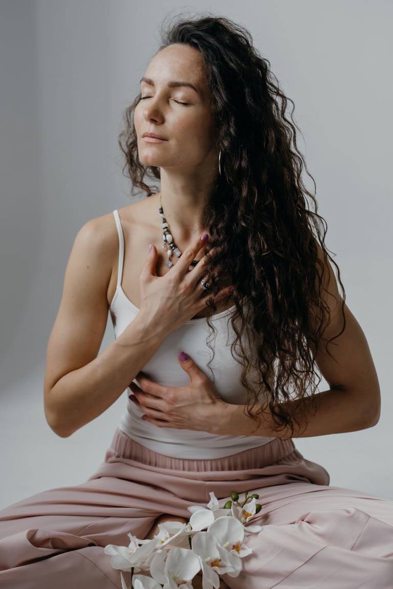 Portrait of a serene woman meditating with eyes closed, capturing relaxation and mindfulness.